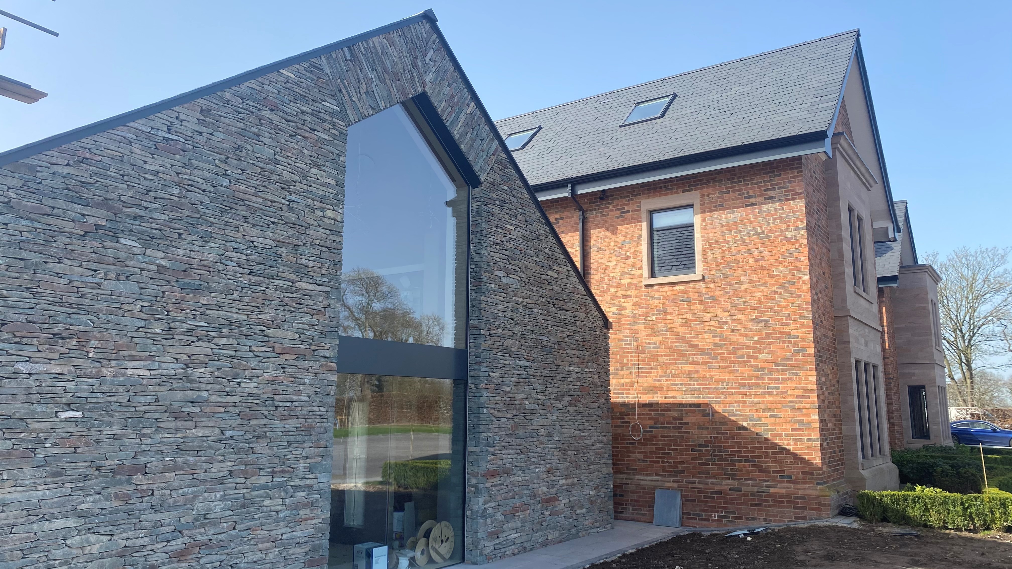 Slate wall with tall glass window