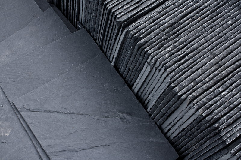 Slate roofing tiles in a pallet ready for sale sale as a construction material at a building suppliers