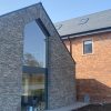 Slate wall with tall glass window